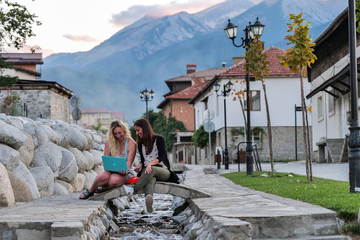 Bansko old town with traditional architecture and Pirin mountains in the background