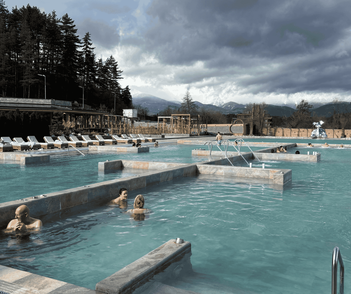 Outdoor thermal pools in Bulgaria with views of the Pirin mountains in winter