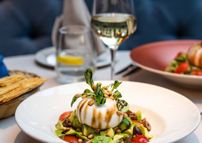 Burrata salad with avocado and tomatoes at Captain Cook restaurant in Sofia, Bulgaria